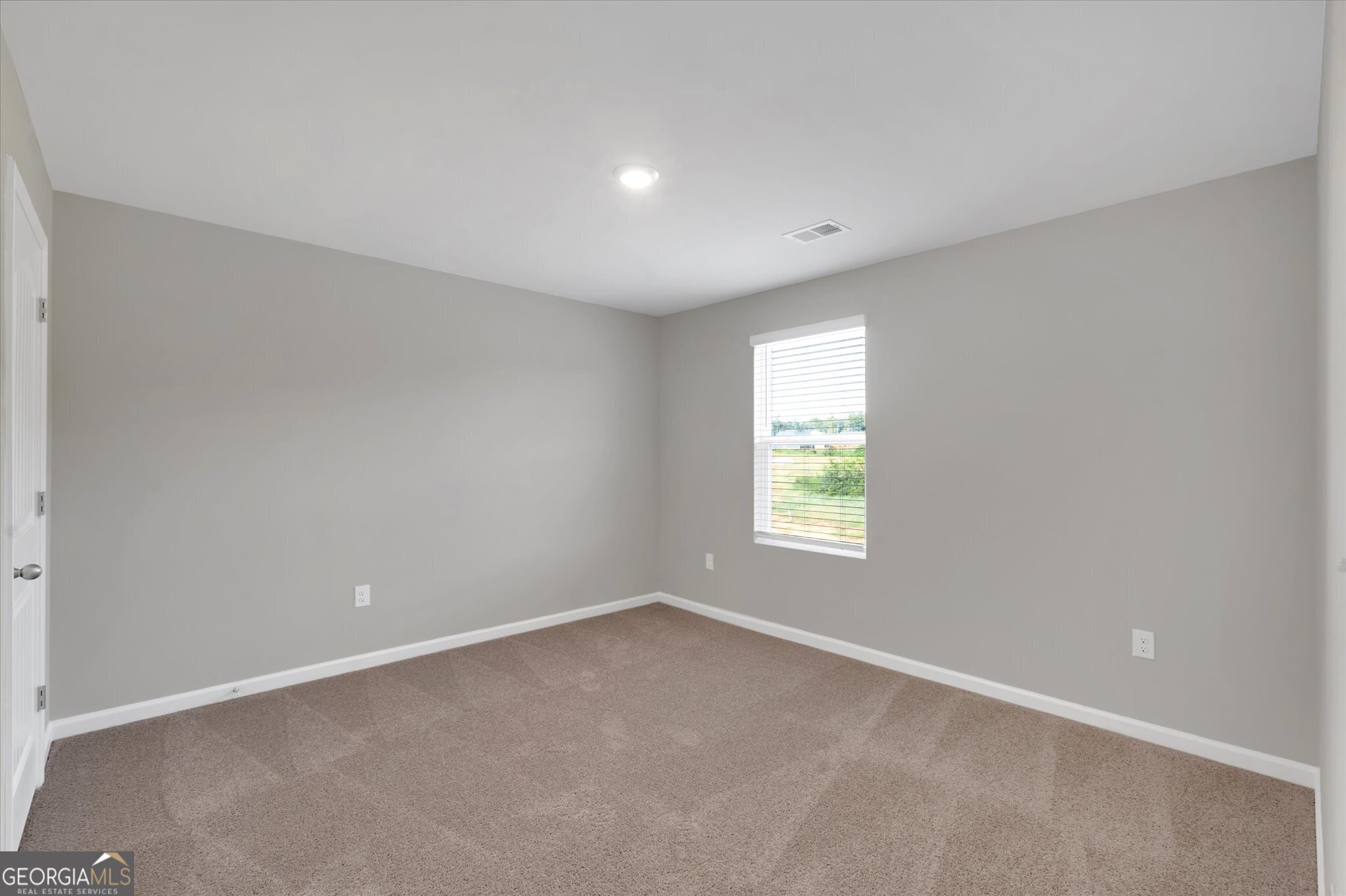 5357 Tolar Road South Fulton, GA 30213 - Photo 14 of 27 an empty room with windows