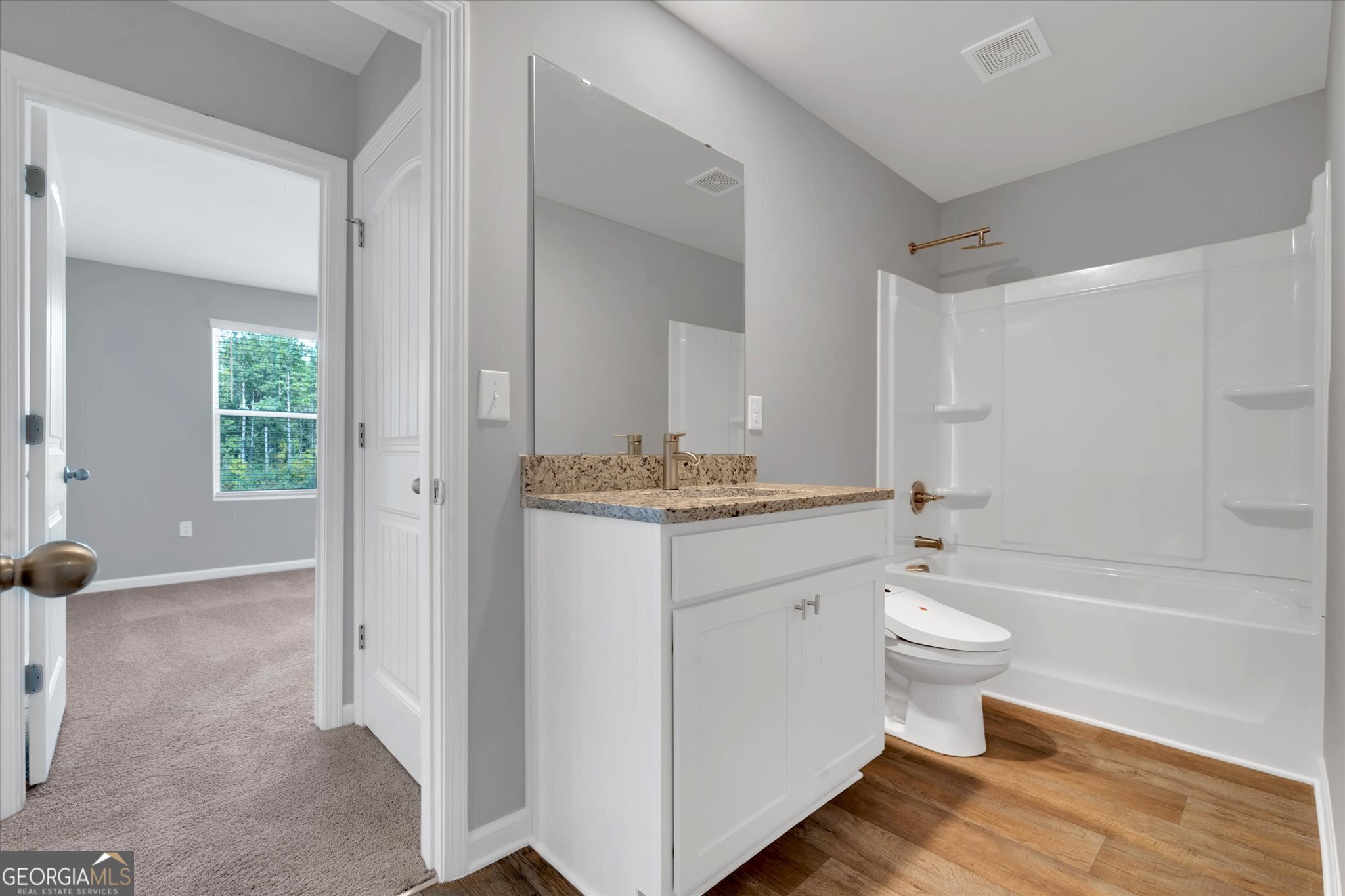 5357 Tolar Road South Fulton, GA 30213 - Photo 17 of 27 a bathroom with a granite countertop sink toilet and shower