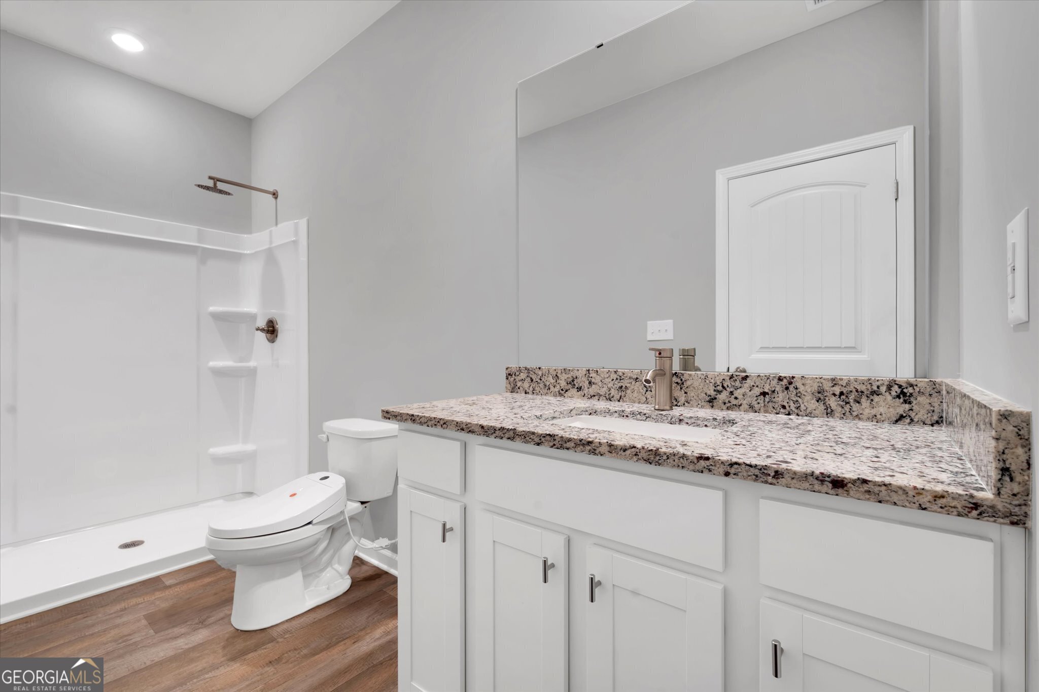 5357 Tolar Road South Fulton, GA 30213 - Photo 18 of 27 a bathroom with a granite countertop sink toilet a large mirror and shower