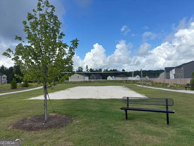 a view of a bench in a park