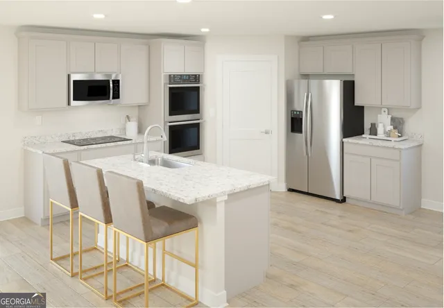 a kitchen with stainless steel appliances a refrigerator and a stove top oven