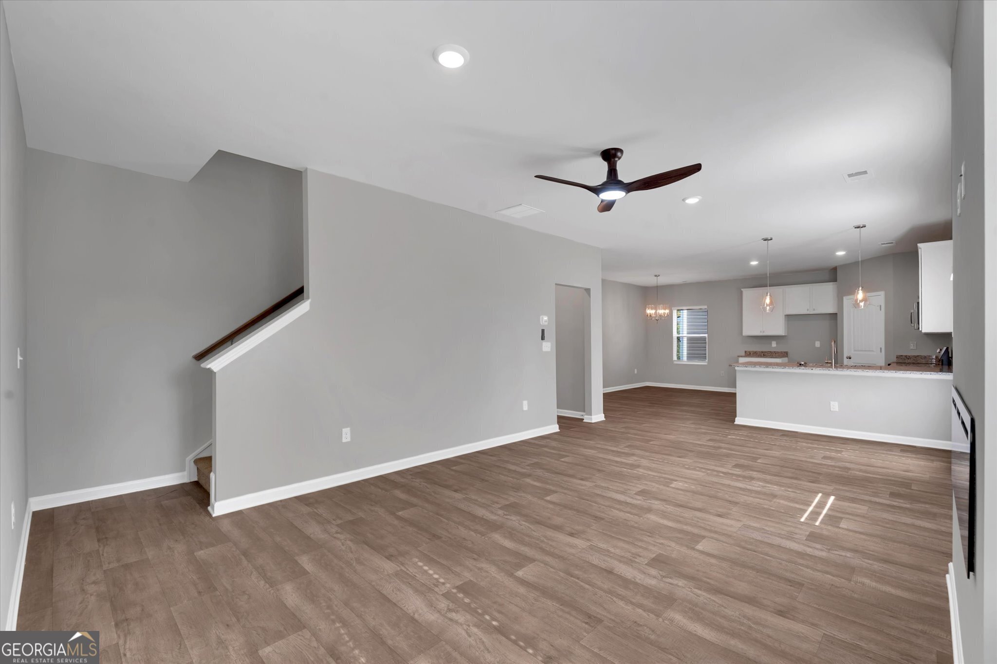 5357 Tolar Road South Fulton, GA 30213 - Photo 5 of 27 a view of a livingroom with a ceiling fan & wooden floor