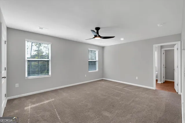 a view of an empty room with a window