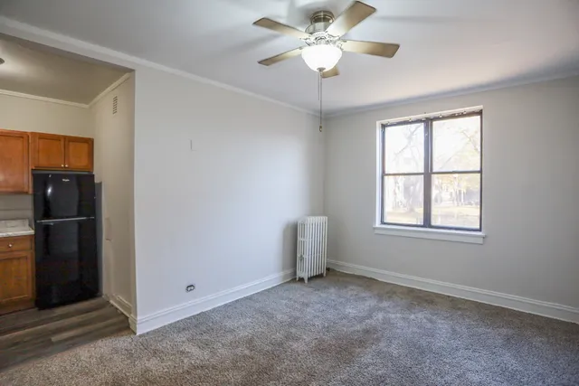 a view of an empty room with a window