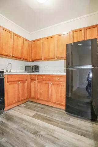 a kitchen with a sink and cabinets