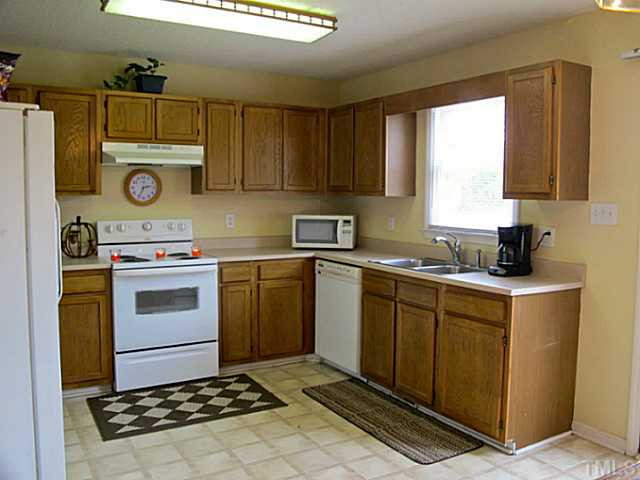 1460 White Memorial Church Road Willow Spring, NC 27592 - Photo 5 of 14 Kitchen with view of the open backyard