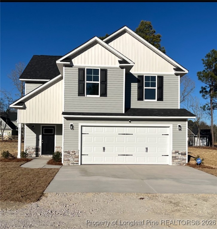 a front view of a house with garage