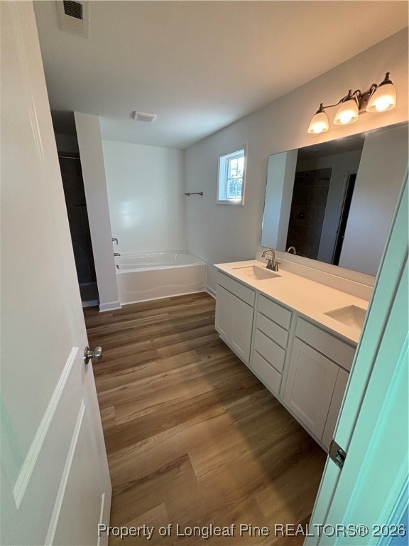 237 Musket Lane Raeford, NC 28376 - Photo 11 of 18 a bathroom with a sink a toilet and mirror