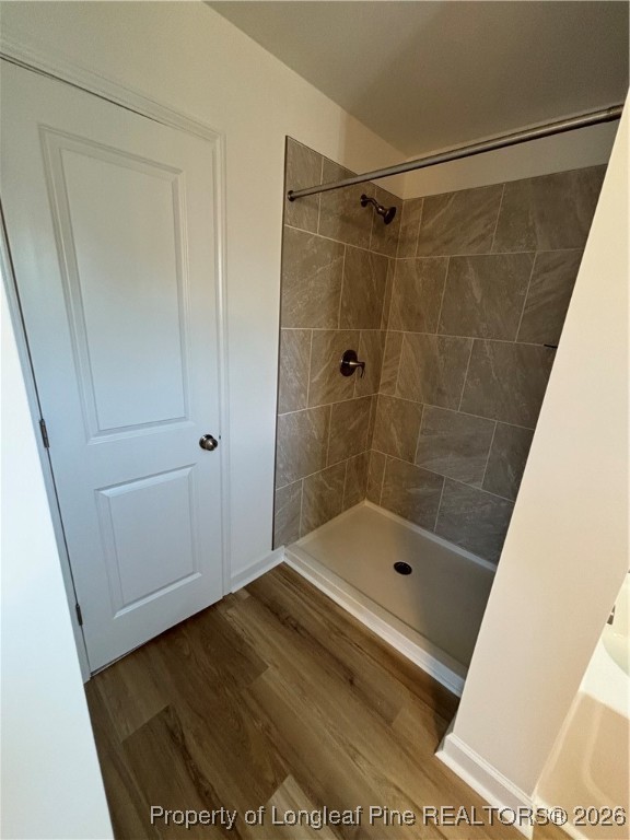 237 Musket Lane Raeford, NC 28376 - Photo 13 of 18 a bathroom with a shower and a bath tub