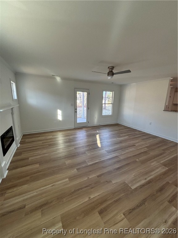 237 Musket Lane Raeford, NC 28376 - Photo 6 of 18 a view of an empty room with window and wooden floor