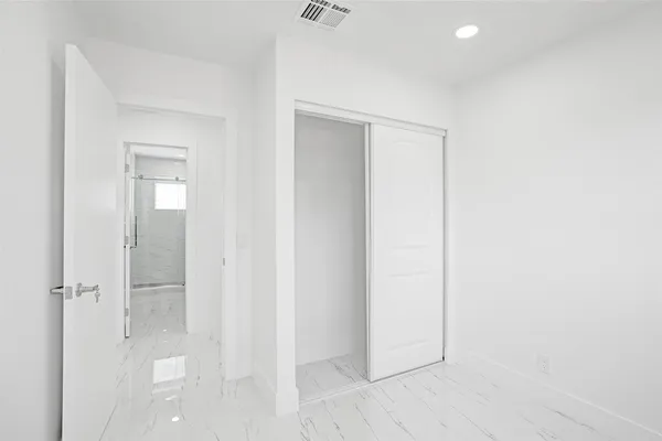 an empty room with wooden floor