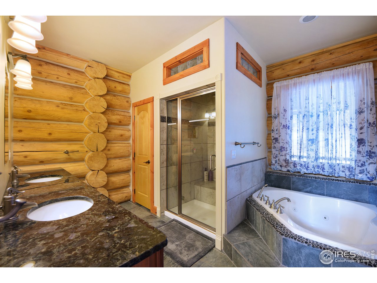 500 Ridge Road Ward, CO 80481 - Photo 14 of 31 a bathroom with a granite countertop sink toilet and shower