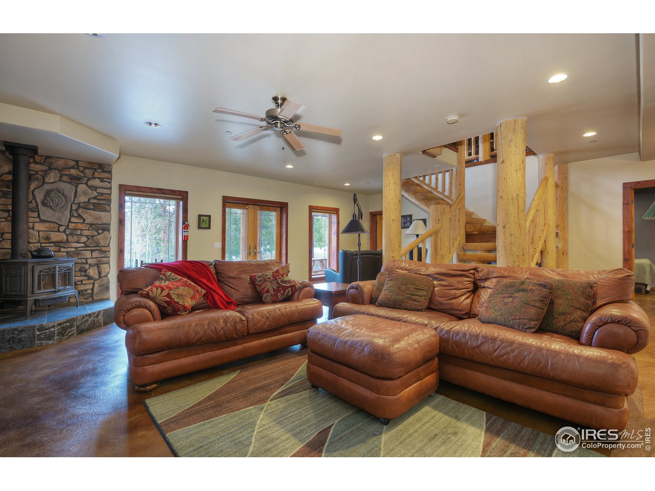 500 Ridge Road Ward, CO 80481 - Photo 21 of 31 a living room with furniture a ceiling fan and a rug