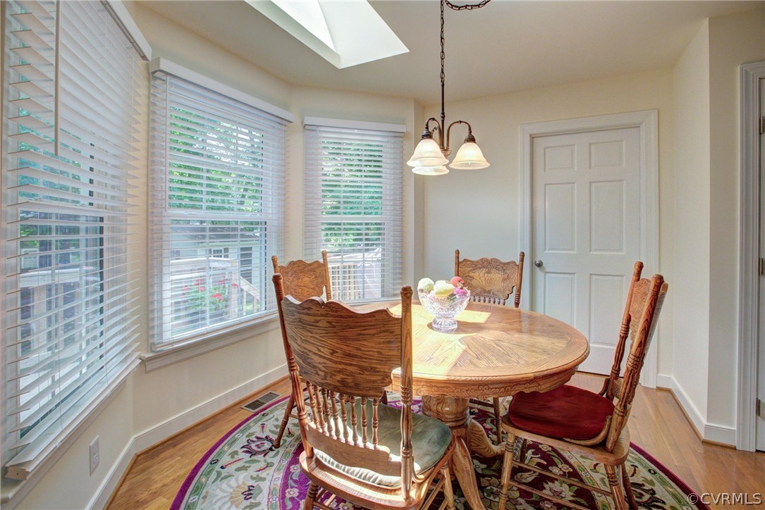 11109 Warren View Road Henrico, VA 23233 - Photo 13 of 38 Eat-in portion of the kitchen with chandelier and