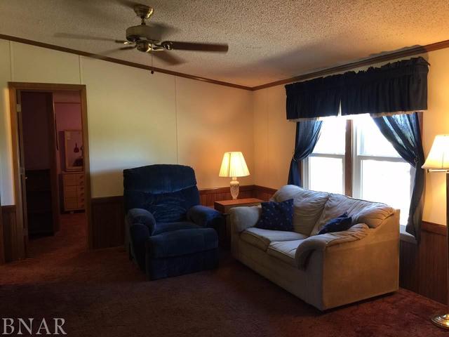 12846 Taft Road Clinton, IL 61727 - Photo 5 of 21 a living room with furniture and a window