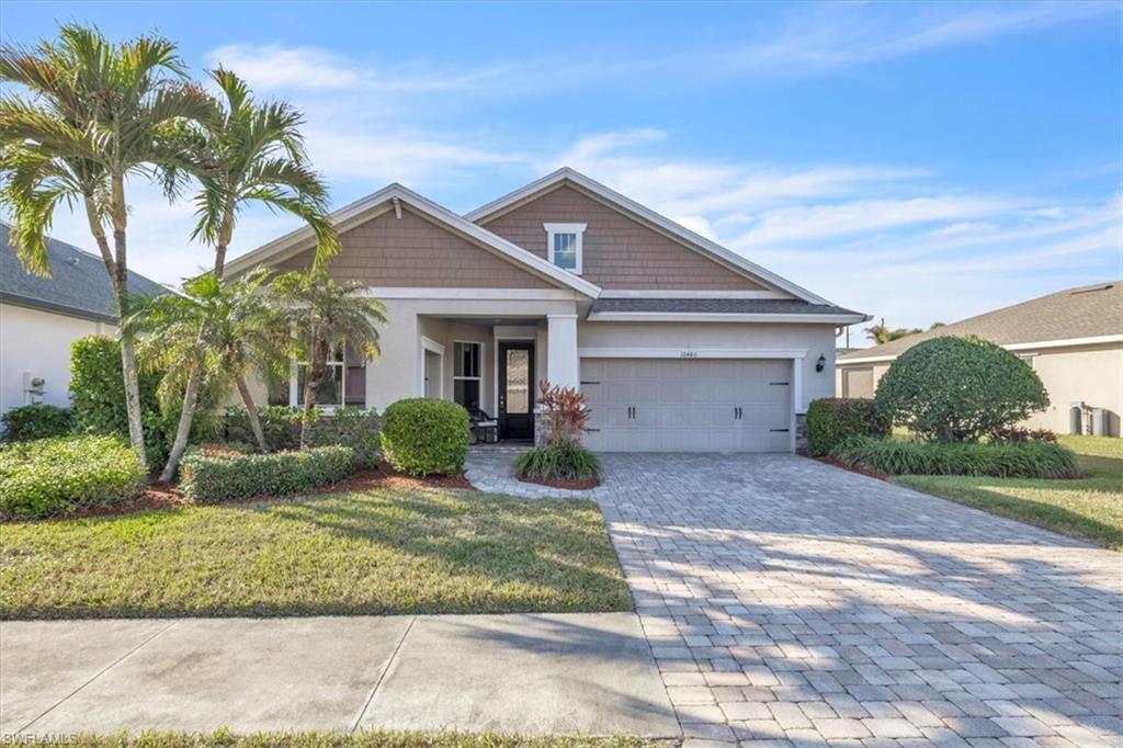 16480 Windsor Way Alva, FL 33920 - Photo 1 of 48 a front view of a house with a yard and garage