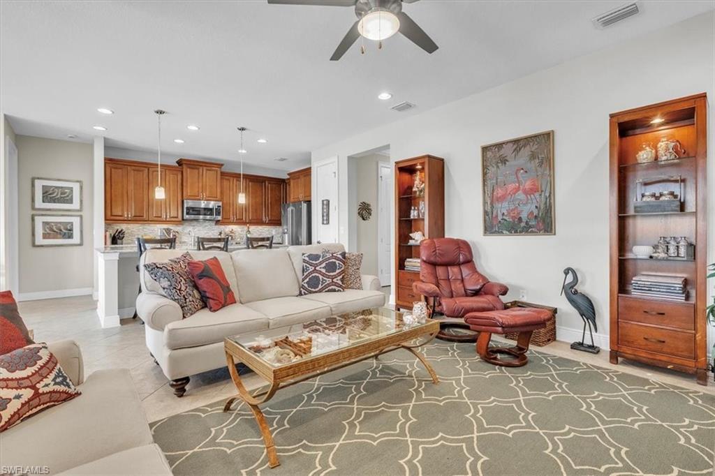 16480 Windsor Way Alva, FL 33920 - Photo 13 of 48 a living room with furniture and a view of kitchen