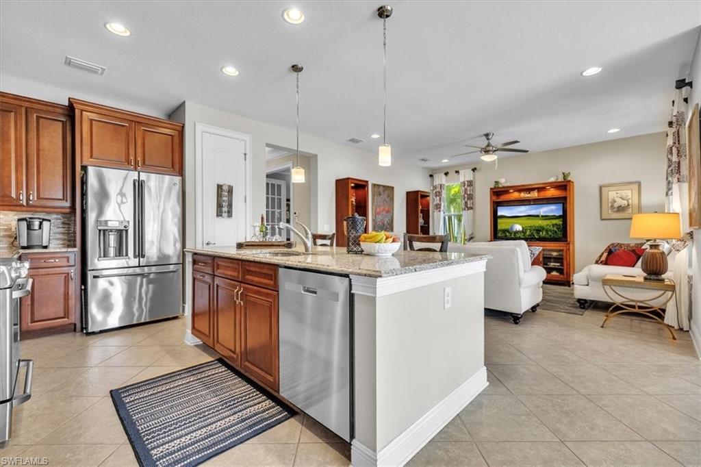 16480 Windsor Way Alva, FL 33920 - Photo 16 of 48 a large white kitchen with lots of counter space and stainless steel appliances