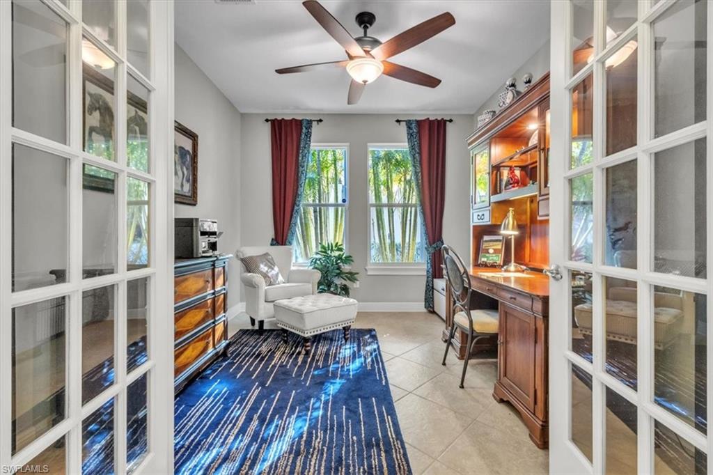 16480 Windsor Way Alva, FL 33920 - Photo 24 of 48 a living room with furniture wooden floor and a large window