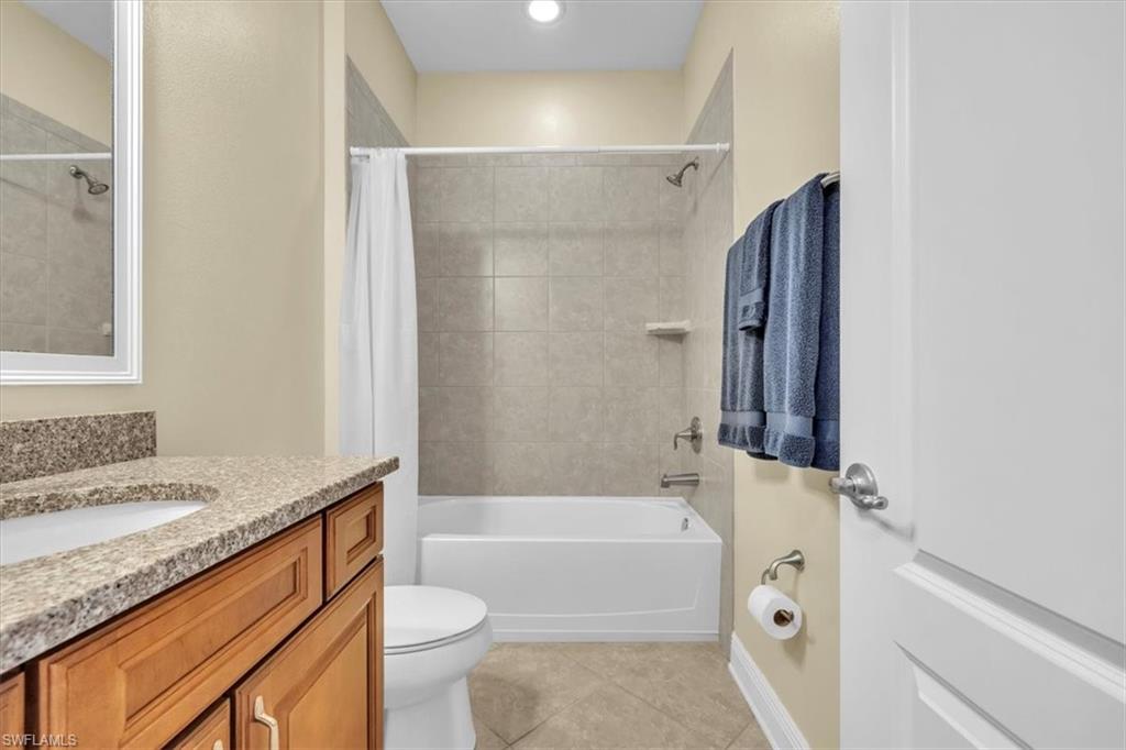 16480 Windsor Way Alva, FL 33920 - Photo 29 of 48 a bathroom with a granite countertop sink toilet and shower