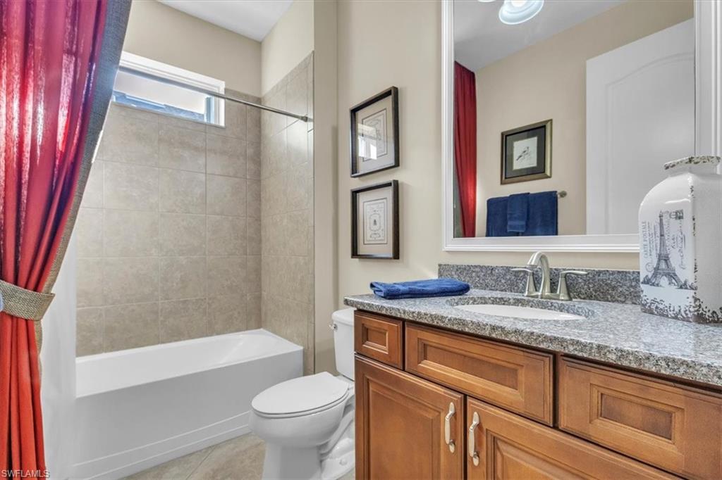 16480 Windsor Way Alva, FL 33920 - Photo 32 of 48 a bathroom with a granite countertop sink toilet and shower