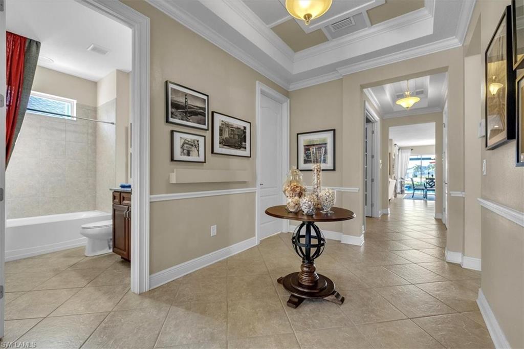 16480 Windsor Way Alva, FL 33920 - Photo 7 of 48 a view of a hallway with wooden floor and furniture