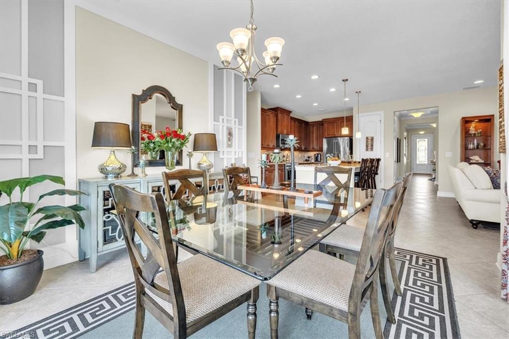 16480 Windsor Way Alva, FL 33920 - Photo 9 of 48 a view of a dining room with furniture a chandelier and wooden floor