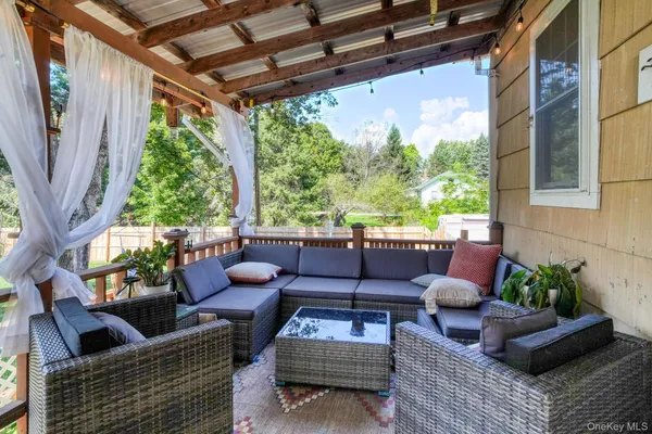 a outdoor living space with patio furniture and a potted plant