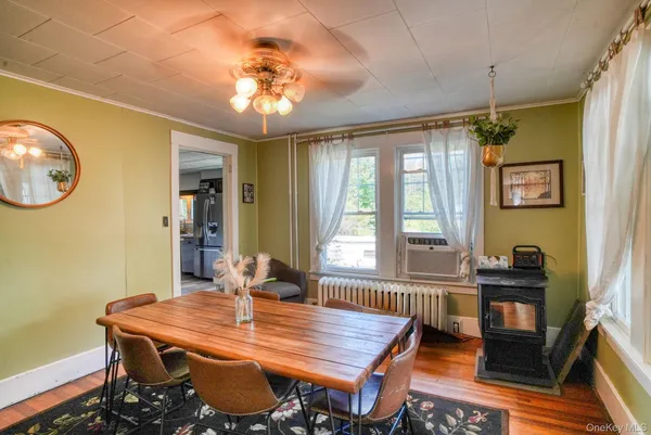 a view of a dining room with furniture window and outside view