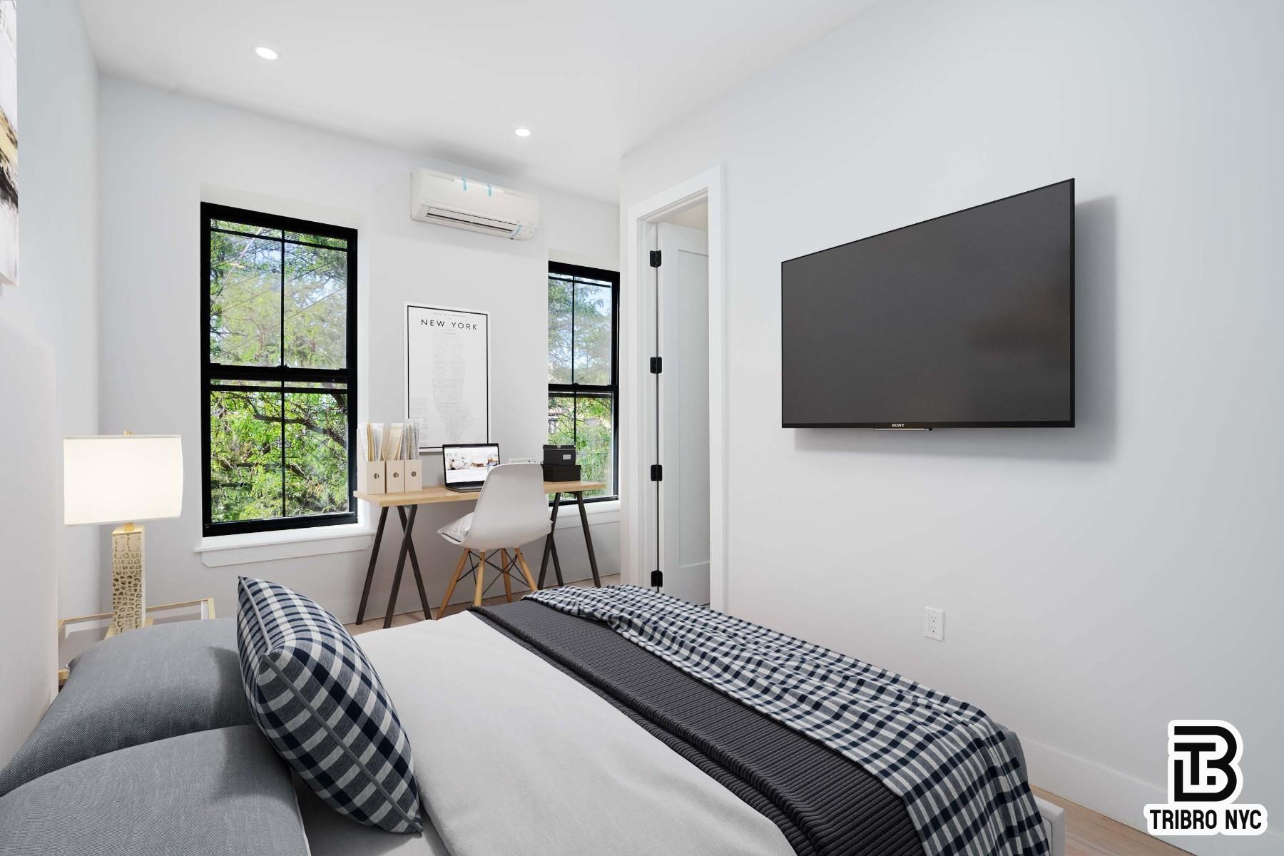 62-15 Catalpa Avenue, Unit 3A Queens, NY 11385 - Photo 1 of 9 a bedroom with a bed and a flat screen tv