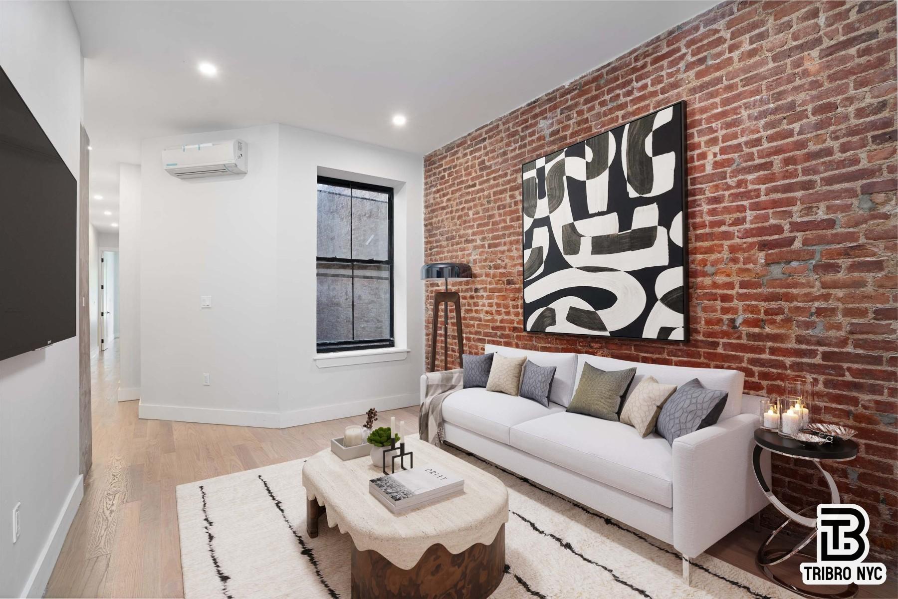 62-15 Catalpa Avenue, Unit 3A Queens, NY 11385 - Photo 2 of 9 a living room with furniture and a flat screen tv