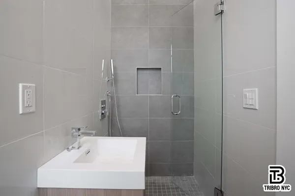 a bathroom with a sink and shower