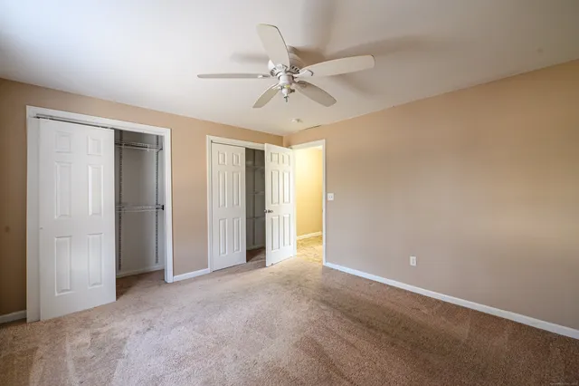 a view of a bathroom from a hallway