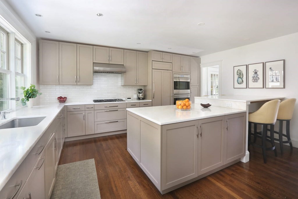12 Nathan Road Newton, MA 02459 - Photo 4 of 20 a kitchen that has a lot of cabinets in it and wooden floors
