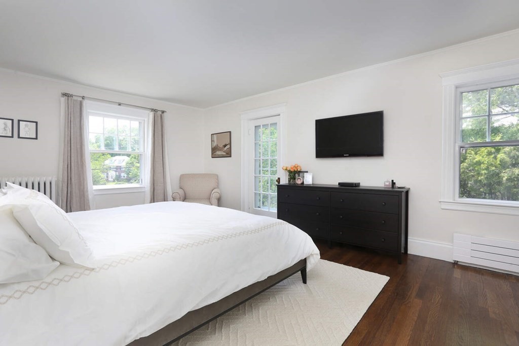 12 Nathan Road Newton, MA 02459 - Photo 10 of 20 a bedroom with a bed and a flat screen tv