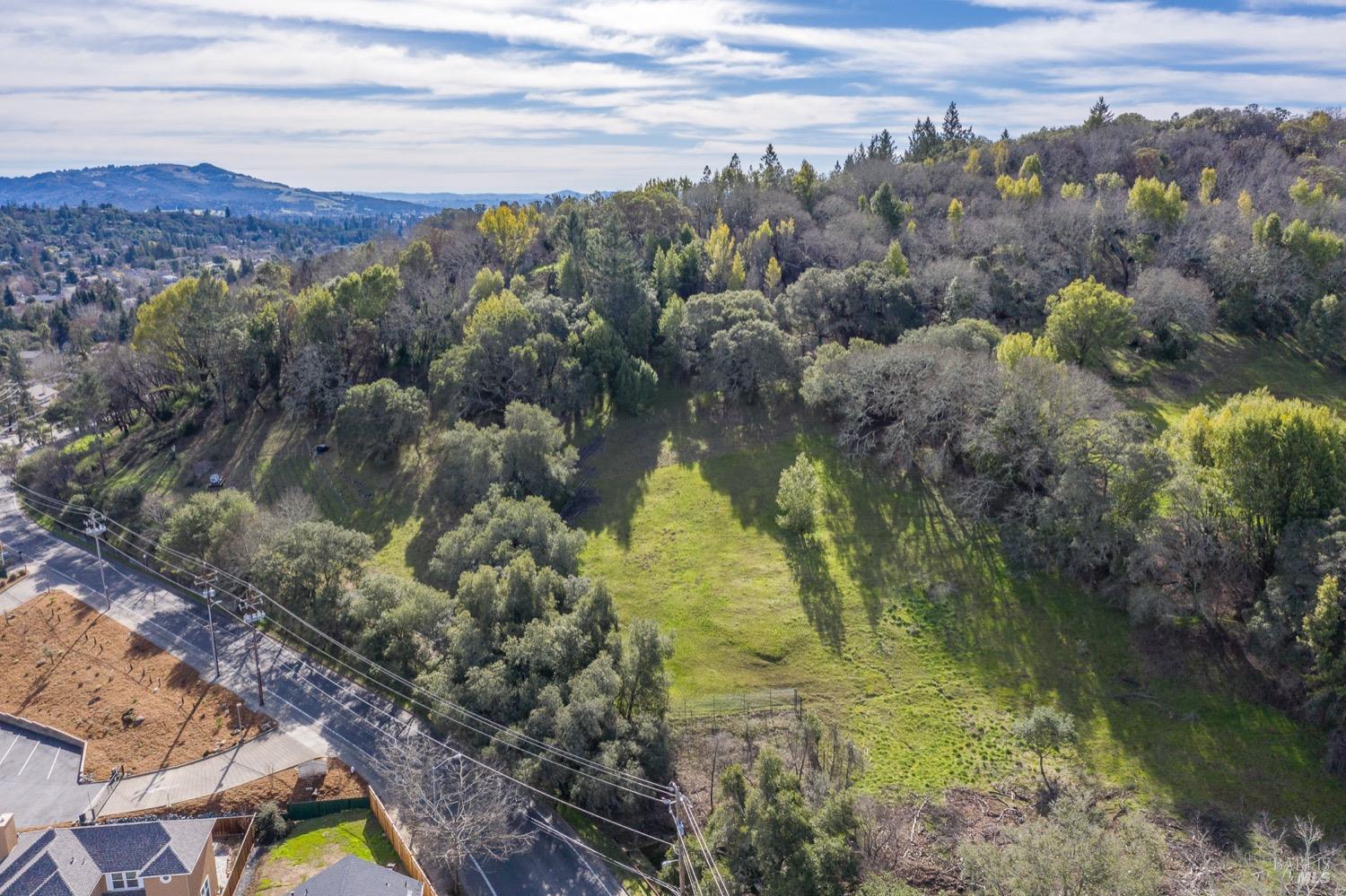 3473 Parker Hill Road Santa Rosa, CA 95404 - Photo 12 of 35 a view of a lake with mountains in the background