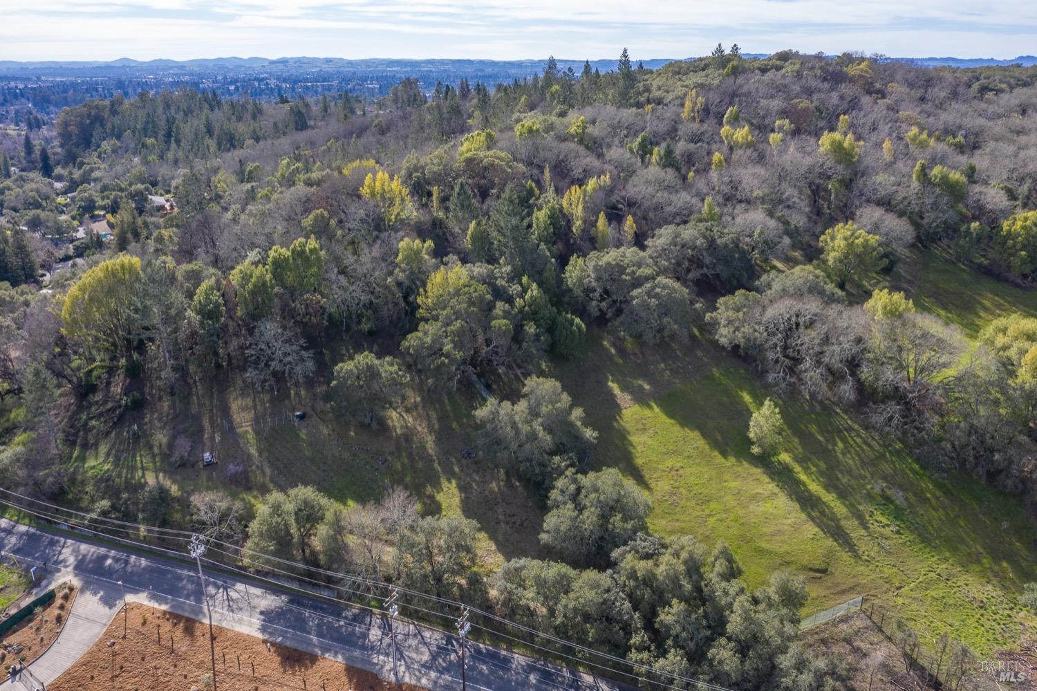 3473 Parker Hill Road Santa Rosa, CA 95404 - Photo 13 of 35 a view of a lake with mountains in the background