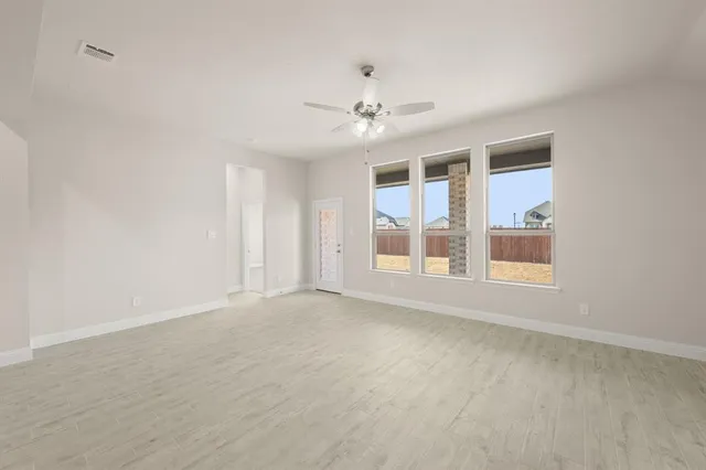 a view of an empty room with a window