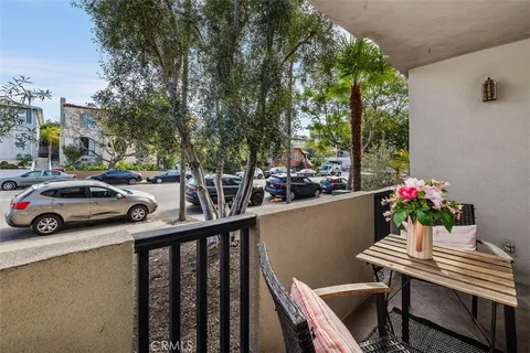 a view of balcony with furniture