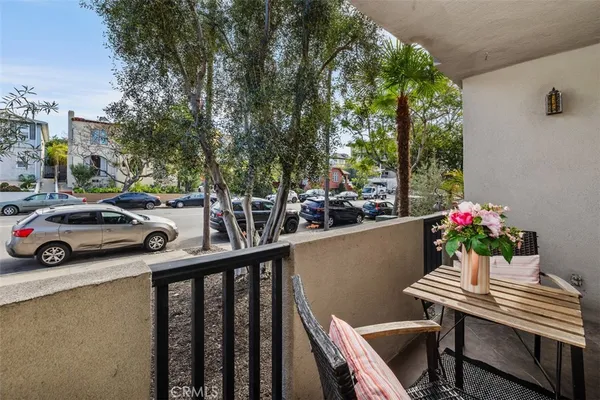 a view of balcony with furniture