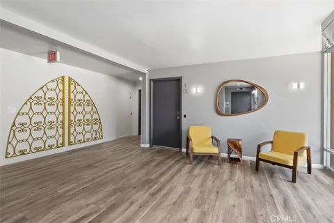 a view of a livingroom with furniture and a wooden floor