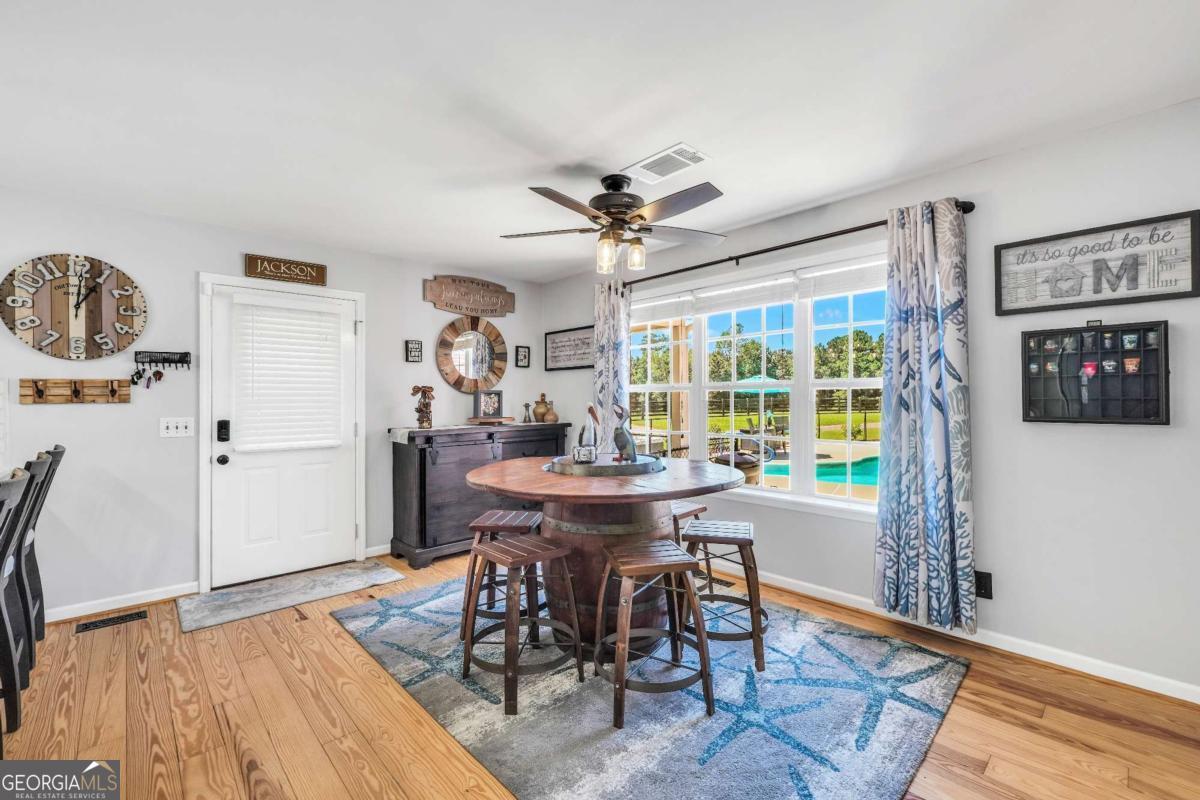 159 County Line Road Locust Grove, GA 30248 - Photo 14 of 100 a view of a dining room with furniture window and wooden floor