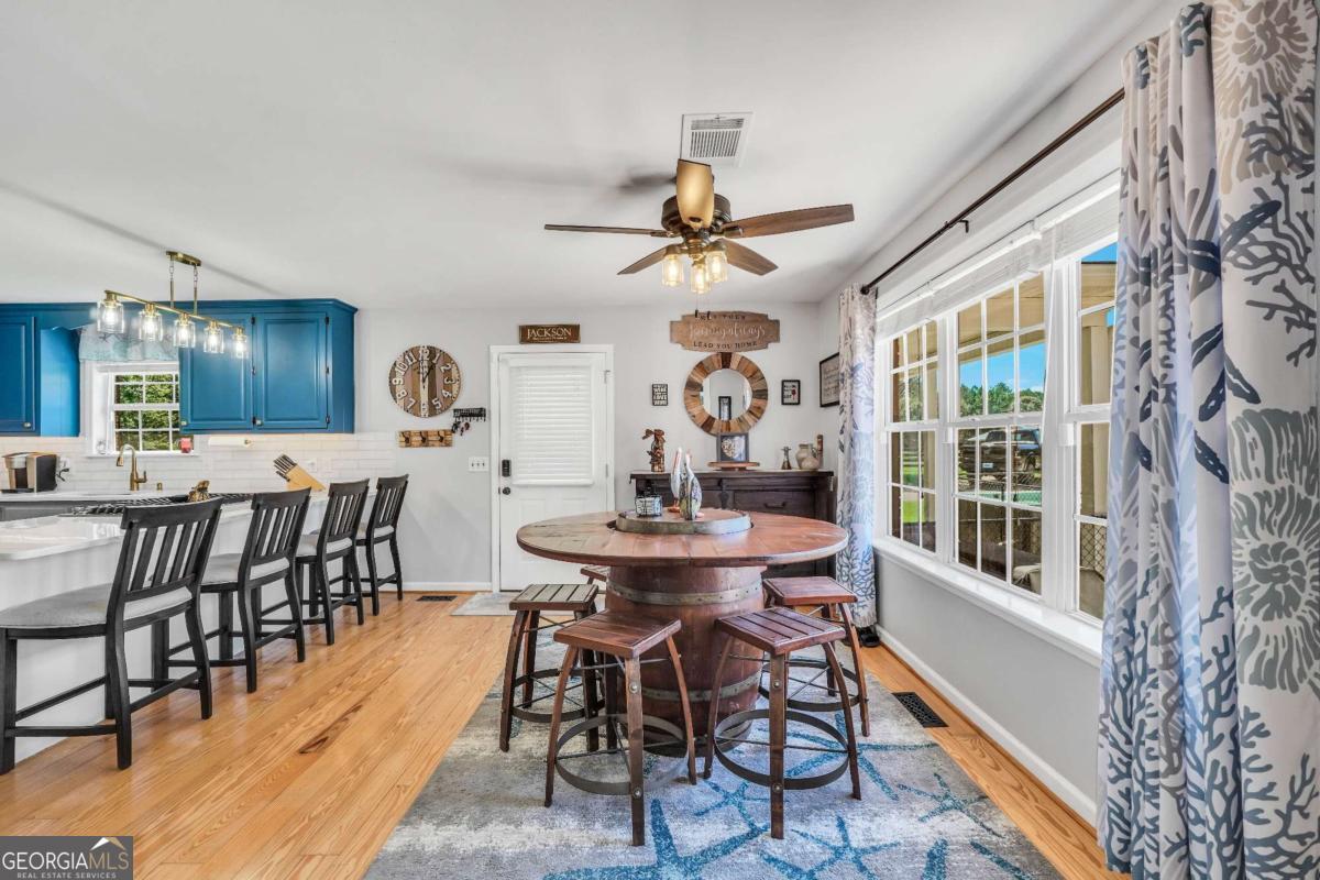 159 County Line Road Locust Grove, GA 30248 - Photo 15 of 100 a view of a dining room with furniture window and wooden floor