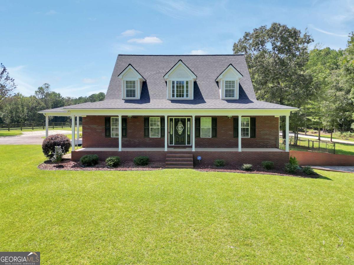 159 County Line Road Locust Grove, GA 30248 - Photo 2 of 100 a view of a house with a yard and sitting area
