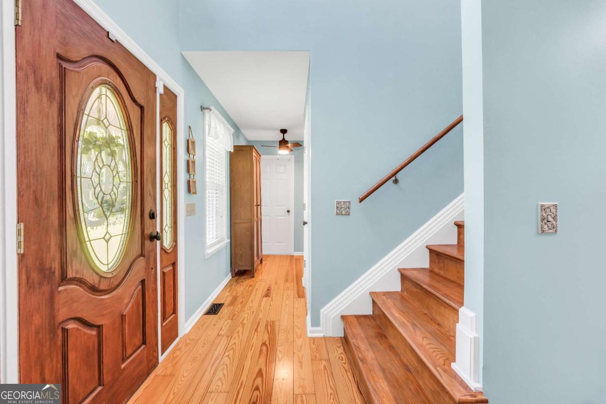 159 County Line Road Locust Grove, GA 30248 - Photo 26 of 100 a view of a hallway with wooden floor and windows