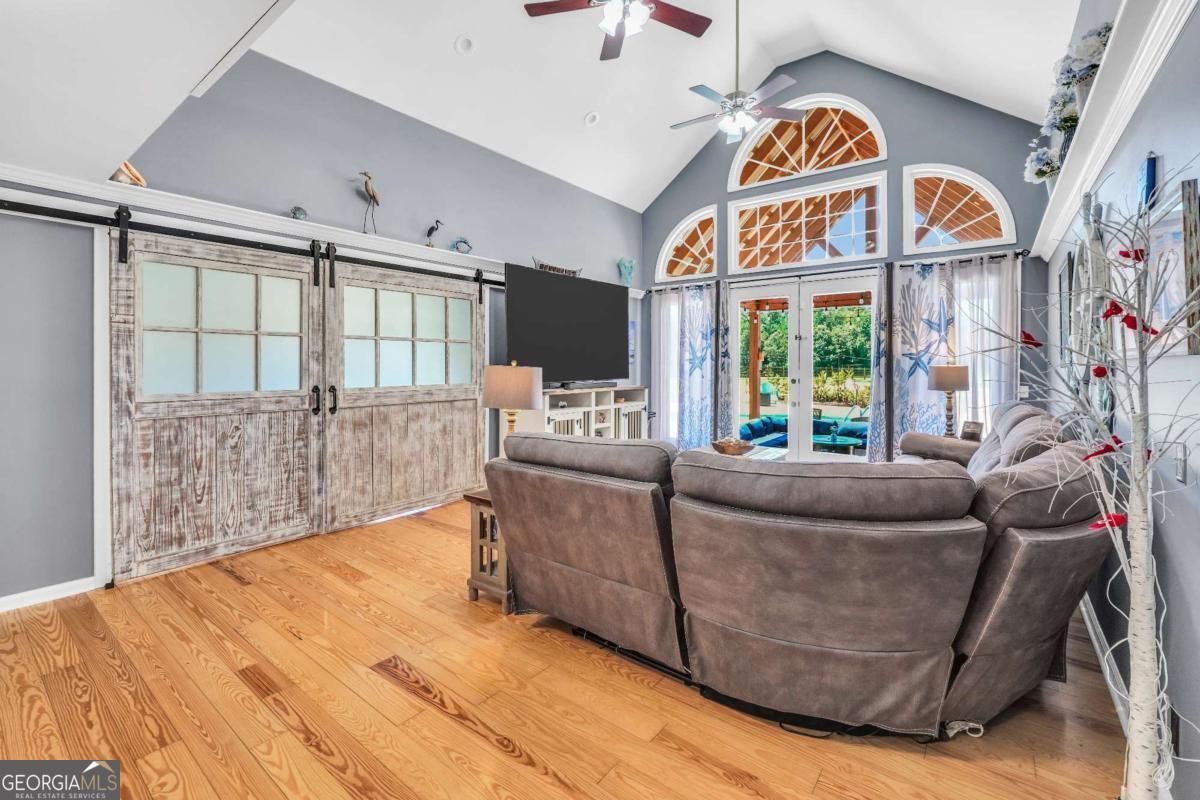 159 County Line Road Locust Grove, GA 30248 - Photo 33 of 100 a living room with furniture and a floor to ceiling window