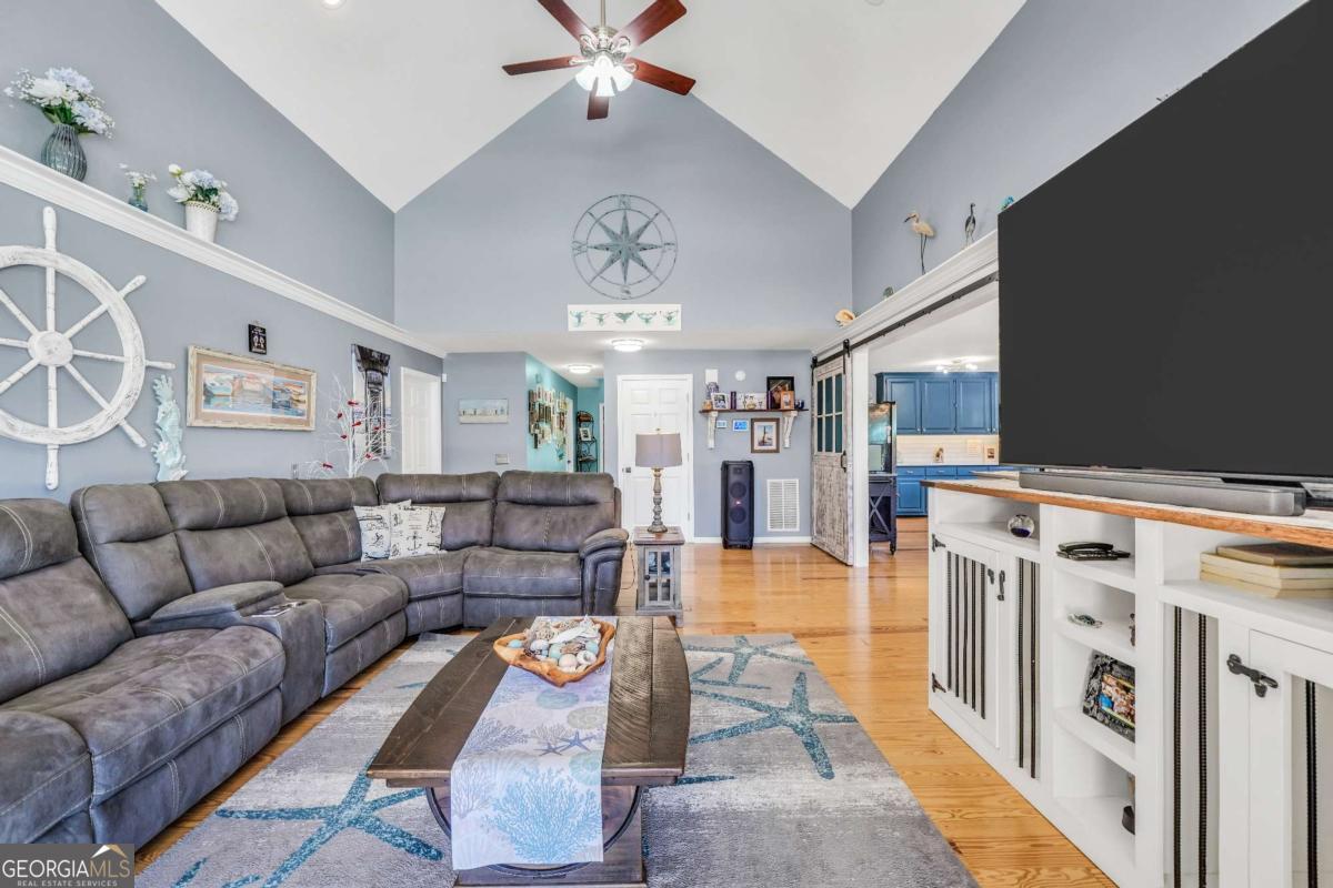 159 County Line Road Locust Grove, GA 30248 - Photo 36 of 100 a living room with furniture and a chandelier