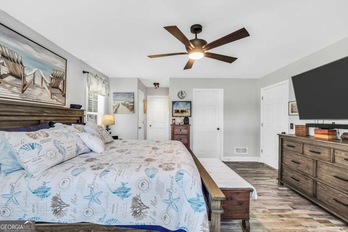 159 County Line Road Locust Grove, GA 30248 - Photo 40 of 100 a bedroom with a bed and a flat screen tv