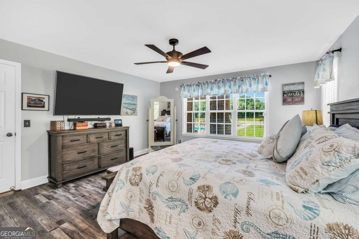 159 County Line Road Locust Grove, GA 30248 - Photo 42 of 100 a bedroom with a bed and a flat screen tv