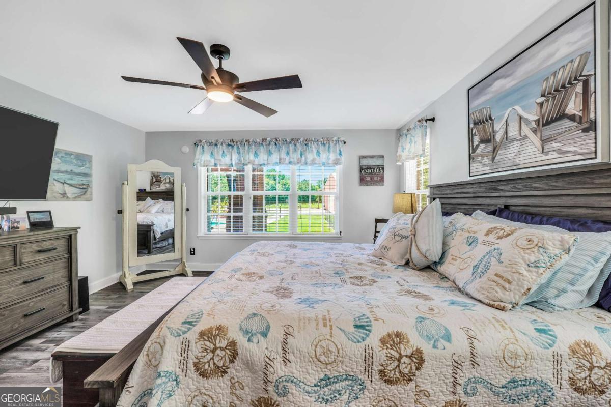 159 County Line Road Locust Grove, GA 30248 - Photo 43 of 100 a bedroom with a large bed and a flat tv screen